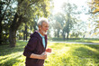 © Marko Geber - Portrait of a senior man jogging in the park on sunny day