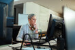 © Geber86 - Focused businesswoman working on office computer