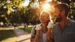 © Nathaphat - First Love. Young couple enjoying ice cream in a sunlit park.