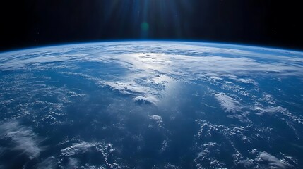 Wall Mural - Stunning view of the Earth from space with clouds, ocean and sun reflection