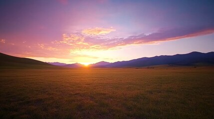 Aufkleber - A stunning sunset lights up the sky with hues of orange, pink, and purple, casting reflections across a serene open field, inviting tranquility and peace