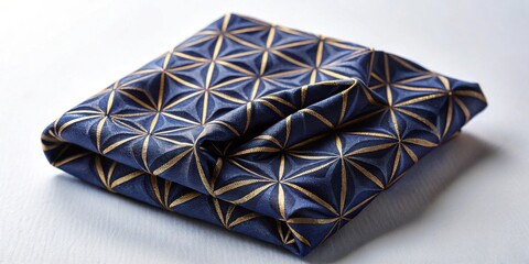Aufkleber - Luxurious navy blue fabric with gold geometric pattern folded on a surface