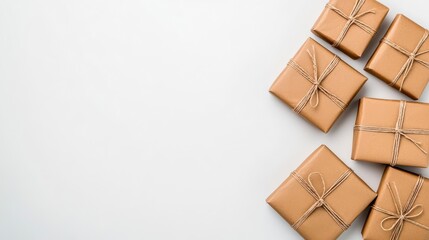 Wall Mural - a photostock of neatly wrapped brown paper packages with visible twine bows, isolated on a clean whi