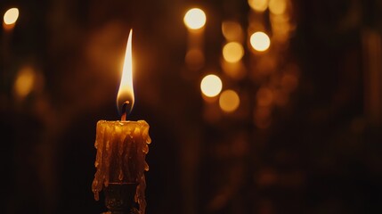 Aufkleber - Close-up of a candle flame flickering softly in the dark, casting a warm, golden glow and creating a serene, peaceful ambiance.