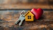 © MdNazim - Heartfelt Homeownership: A Pair of Keys and Love Symbolized by a House-Shaped Keyring with a Red Heart