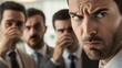 © sungedi - Man with Disapproving Expression and Colleagues Covering Their Mouths