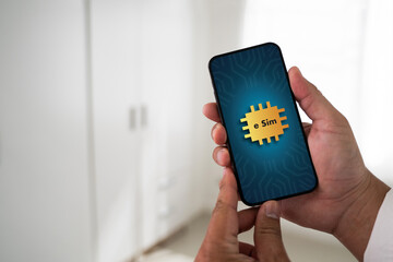 Poster - A person is holding a cell phone with a gold sticker on it that says 