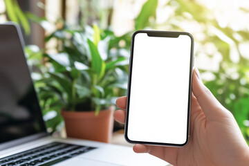Poster - person is holding a cell phone with a white background. The phone is in a hand and the background is a laptop
