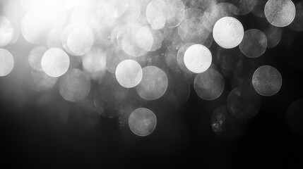 Poster - Abstract black and white background with blurred light circles creating dreamy atmosphere