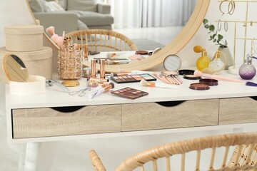 Wall Mural - Makeup room. Dressing table with mirror, different beauty products and chair indoors