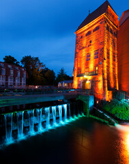 Wall Mural - Historic Water Mill and Weir at the old town of Lüneburg, illuminated for Hanseatic Days Festival