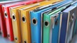 © Planetz - Colorful Binders Organized on a Shelf for Effective Document Management and System Storage Solutions in an Office Environment