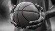 © Alief Shop - Baskeball player clutches the ball firmly