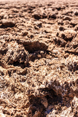 A rocky desert landscape with a few small holes in the ground