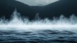 © Rizzz - Ethereal Fog Over Water with Mountain Backdrop in Dark Minimalist Scene