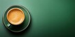 © Mehemmed - Espresso coffee in a green cup on a vibrant green background flat lay style with ample negative space on the right side for text or graphics