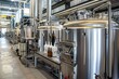 © Arif - A gleaming brewery interior showcases large stainless steel tanks, brewing equipment, and bottles of beer. The facility is modern and clean.