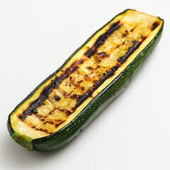 Poster - Grilled zucchini slice showcasing charred edges and tender texture on a white background