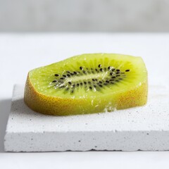 Poster - Ripe kiwi slice showcasing vibrant green color and intricate seed pattern on a neutral background