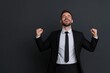 © NEW KUNG - Businessman Celebrating Success with Smiles and Raised Fists in Suit