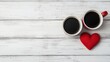 © Arfa_Media - Two red coffee mugs and a heart celebrating Valentine's Day on a white wooden table