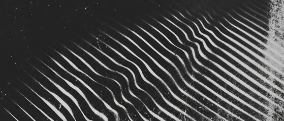 Poster - Unique patterns created by light and shadow on a textured surface in monochrome