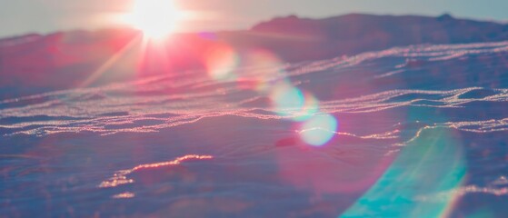 Poster - Bright sunlight reflects off snow-covered terrain during winter afternoon in a serene landscape