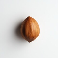 Poster - Roasted hazelnut resting on a smooth white surface ready to be enjoyed as a delicious snack