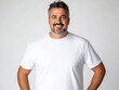 © WE.ARE.AI - white t-shirt mockup for man plus size A smiling man in a plain white t-shirt stands confidently with his hands on his hips against a light background.