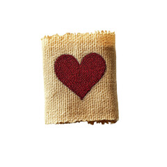 Poster - A small square piece of burlap features a red embroidered heart in the center against a black background.