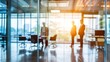 © Iman00 - A blurred, interior business people at tables through a glass wall. This appears to be an office setting