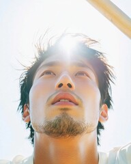 Aufkleber - Sunlit Portrait of Young Asian Man Natural Light on Skin Texture - Visual Content for Modern Lifestyle Brands and Inclusive Marketing Campaigns