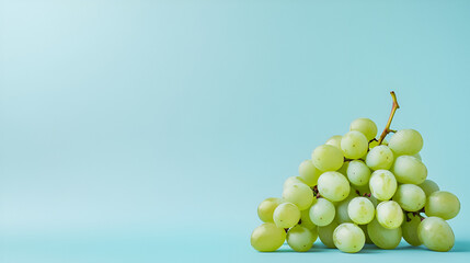 Canvas Print - A bundle of fresh juicy green grapes against a plain background with calming natural light enhances its vibrant appeal.