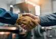 © Sandor - Two factory workers shaking hands, finalizing a deal or celebrating a successful collaboration