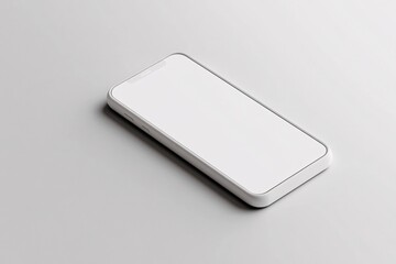 Fototapete - White smartphone showing blank screen lying on gray table