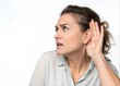 © Aminograpix - Woman Listening with Hand to Ear, Isolated on White Background, Concept of Hearing Problems, Audiometry, and Hearing Loss