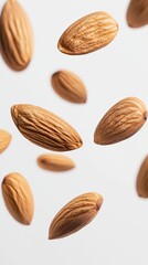 Aufkleber - Levitating shelled almonds create an intriguing visual against a clean white background, highlighting the healthy and delicious qualities of these nutritious nuts