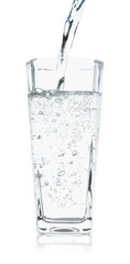 Wall Mural - Pouring refreshing soda water into glass on white background