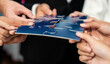 © InfiniteFlow - Multiethnic business people holding jigsaw pieces and merge them together as effective solution solving teamwork, shared vision and common goal combining diverse talent. Meticulous