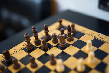 Wall Mural - Strategic chess match in a cozy indoor setting during afternoon hours