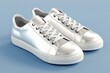 © michnik101 - Pair of metallic sneakers with laces on a light blue background. modern footwear design concept