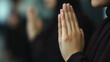 © Marcela - Muslim women praying together in congregation, keeping hands together in worship