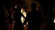 © Konstiantyn Zap - Group of young people enjoying a night bonfire gathering under the stars
