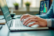 © rarrarorro - Close-up of professional hands typing on a laptop keyboard in a modern office