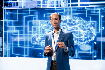 Poster - Portrait of IT engineer speaking at technology summit, explaining impact of AI technology on world. Man wearing suit presenting risks and threats associated with AI during conference