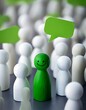 © MRSUTIN - One green, smiling figure stands out from other white figures and speech bubbles.