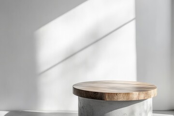 Poster - Minimalist wooden top on concrete pedestal in sunlit room.