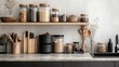 © Julia - Front view of marble countertop with black sink near light ceramic wall and gray furniture in nordic style kitchen. Various jars with food and cooking utensils on stone surface.