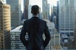 © Dominika - Man in suit looking out over a cityscape from a high-rise building.