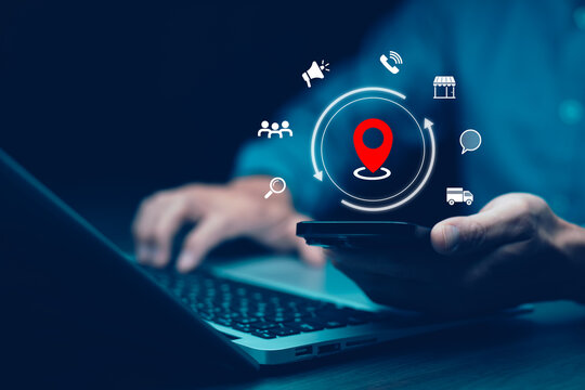 Man using laptop with virtual world and model map with location point , GPS app, icon Travel maps and find places in the online system, all screen graphics are generated,Searching for travel.